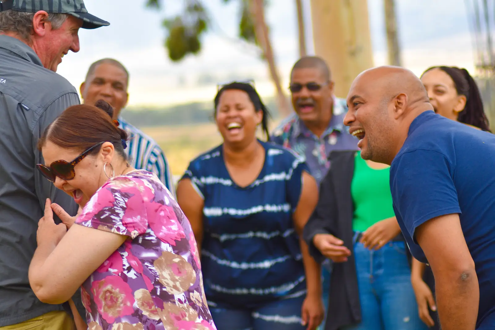 Team Connect facilitator sharing a meaningful moment with a corporate team during an outdoor activity
