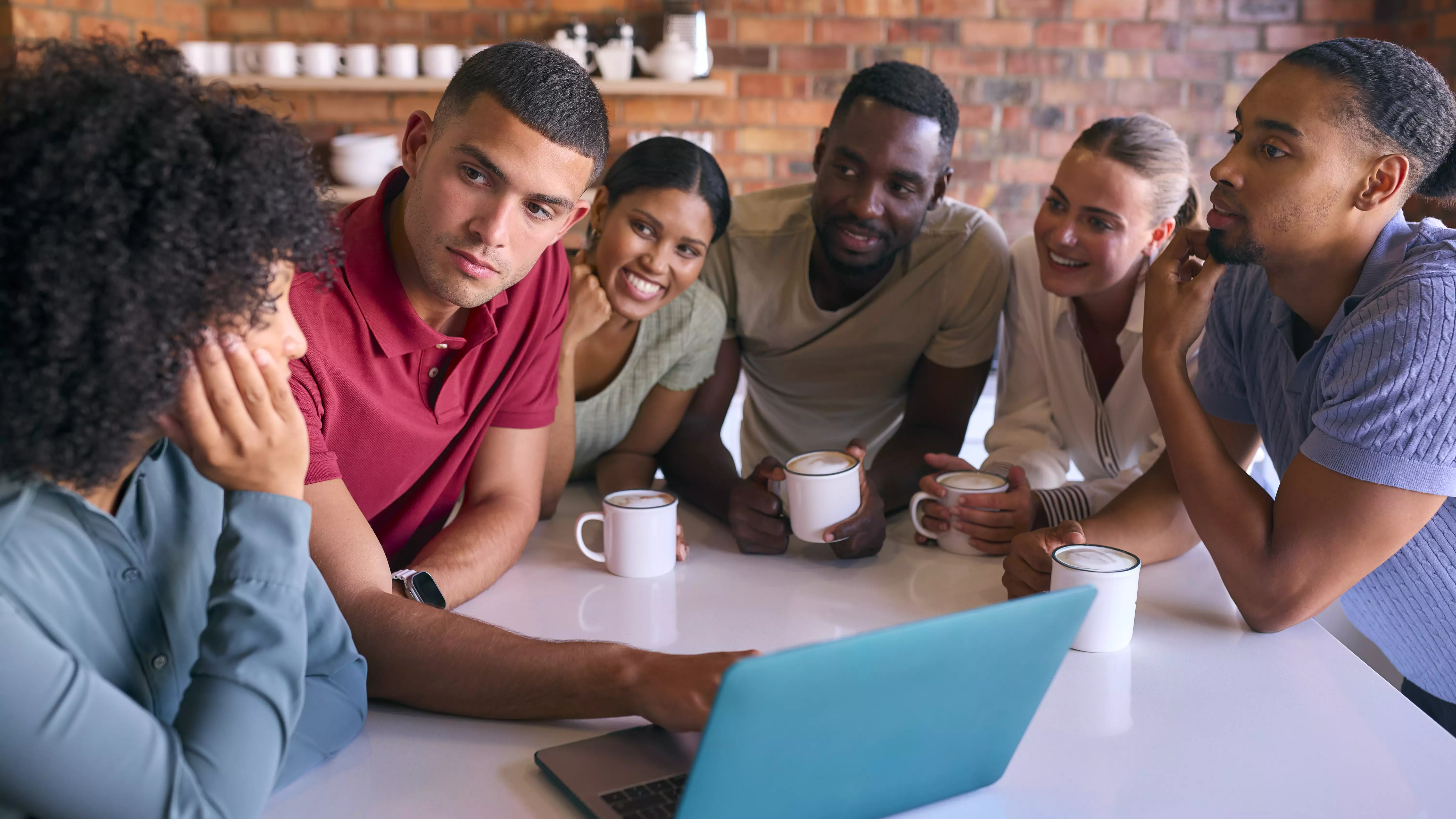 Team Connect corporate development — a small group of South African professionals in focused, considered discussion around a whiteboard