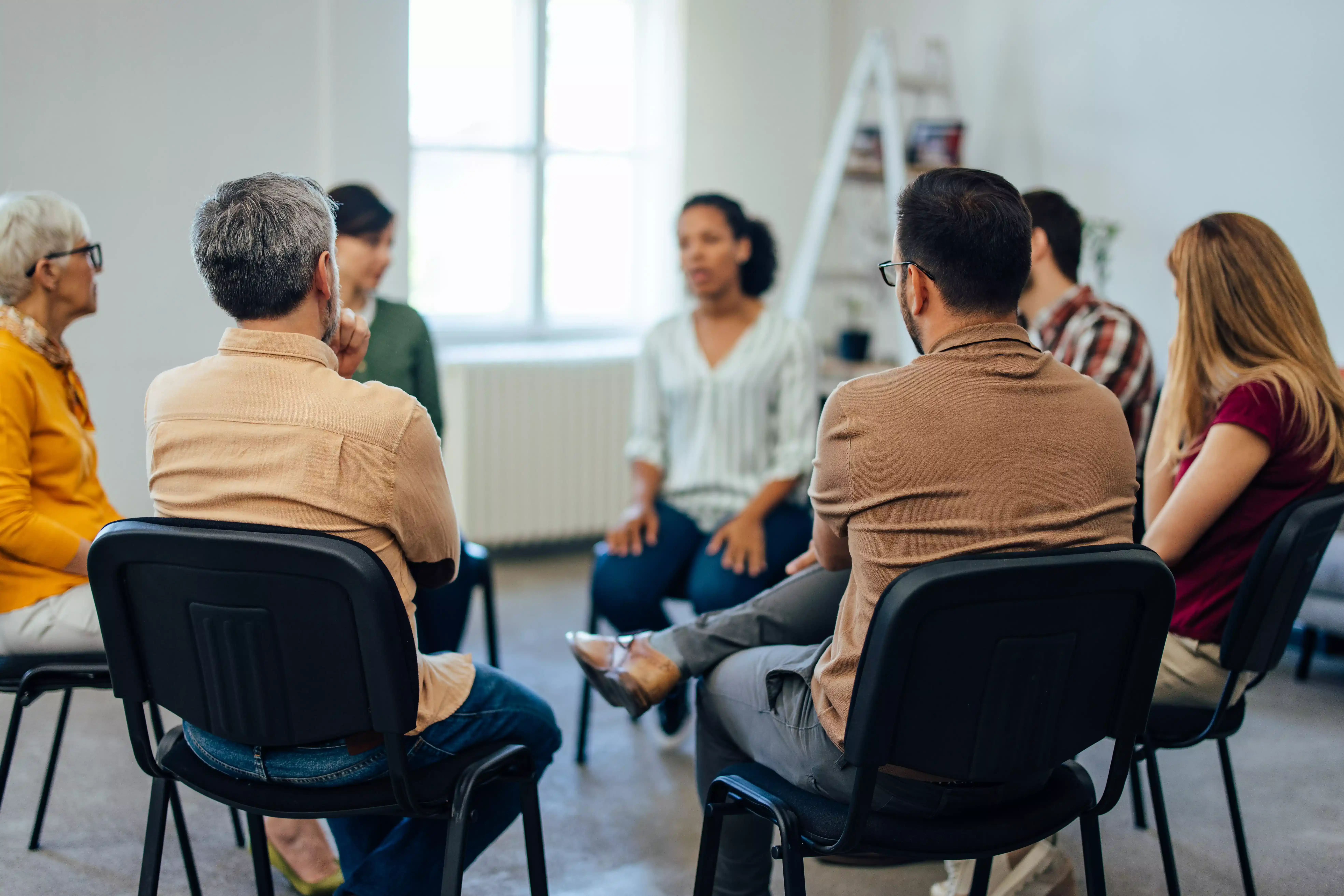 ExecuMed employee wellbeing programme — a small group in an ongoing wellness education session